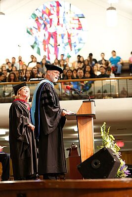 La Sierra University Church Senior Pastor Chris Oberg and university Provost Steve Pawluk address the student body. 