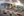 The photographic Creation Wall stands opposite a large mural painting inside of a glass-walled meeting room depicting Jesus and the last supper.