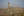 Remains of a Byzantine church and in the far background an arch from the Mamluk Dynasty shrouded in haze&nbsp;at Tall Hisban. (photo courtesy of Doug Clark)