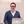 Male La Sierra University Student smiling with computer