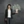 student in front of a blackboard with a money tree chalk drawing