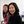 Two liberal studies students in class smiling.