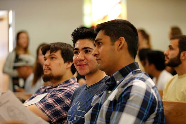 La Sierra students (left to right) Emmanuel Donjuan, Andrew Jones and Jainam Vadecha listen during the 2014 convocation. 