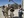 Filming on a military base in Afghanistan for the documentary “CHAPLAINS,” with (left to right) cameraman Nathan DeWild, Chaplain Paul Hurley, filmmaker Martin Doblmeier, and soundman Jeremy Zunk. (Photo courtesy of Journey Films)
